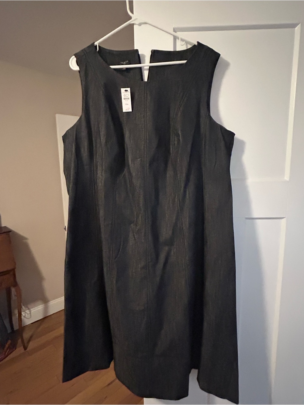 Sleeveless Black A-Line Women's Dress and matching jacket.